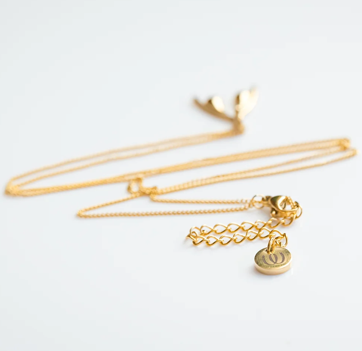 COLLIER OFFICIEL WOMANIZER GOLD CLITORIS