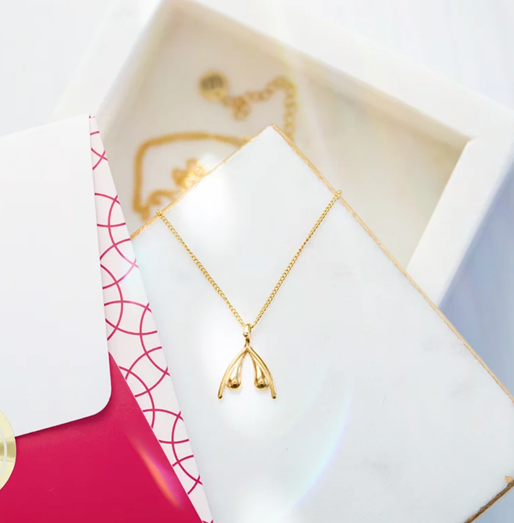 COLLIER OFFICIEL WOMANIZER GOLD CLITORIS